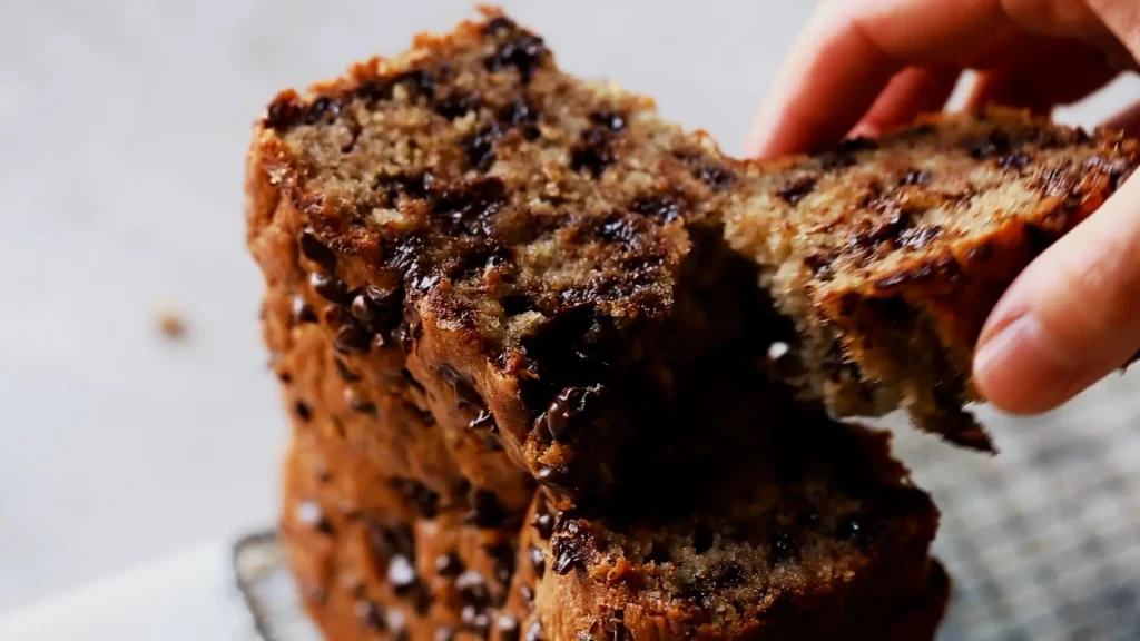 Taking slice of Chocolate Banana Bread