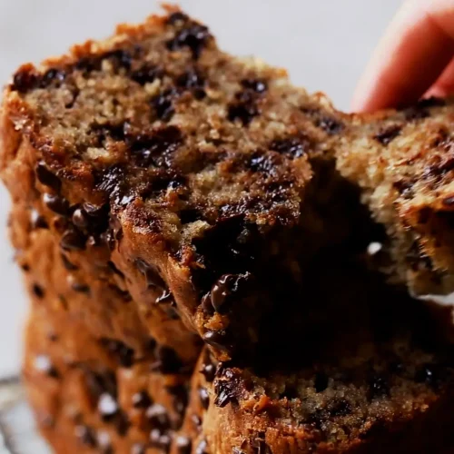 Taking slice of Chocolate Banana Bread