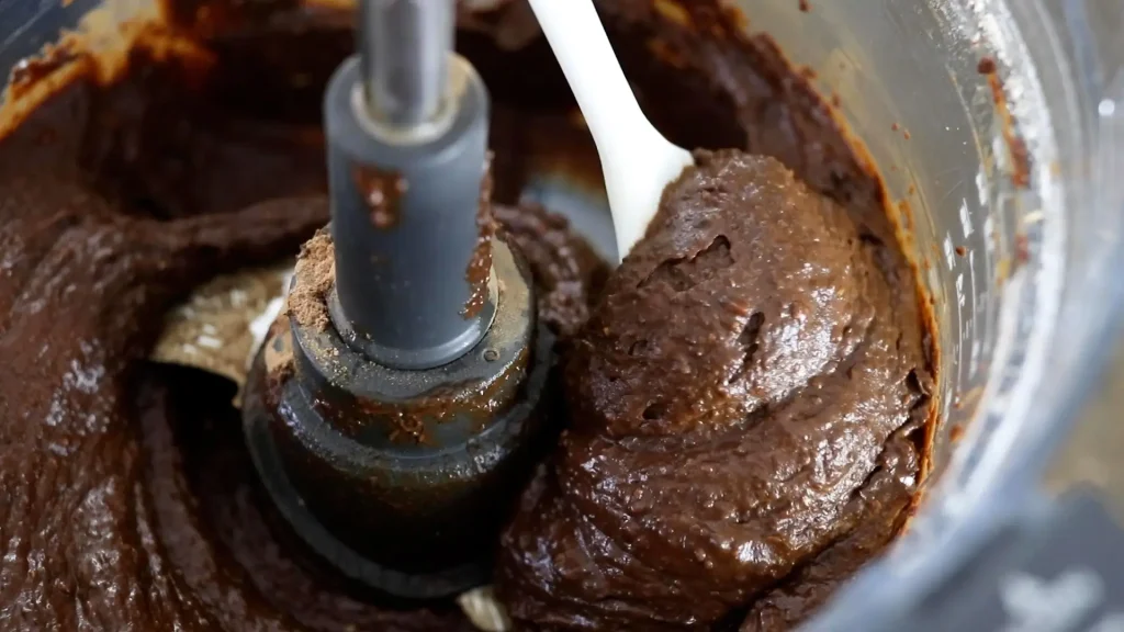 Blending dry ingredients and cocoa powder into mixture