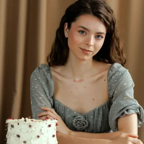 A picture of Emily Morgan (me) sitting in Kitchen