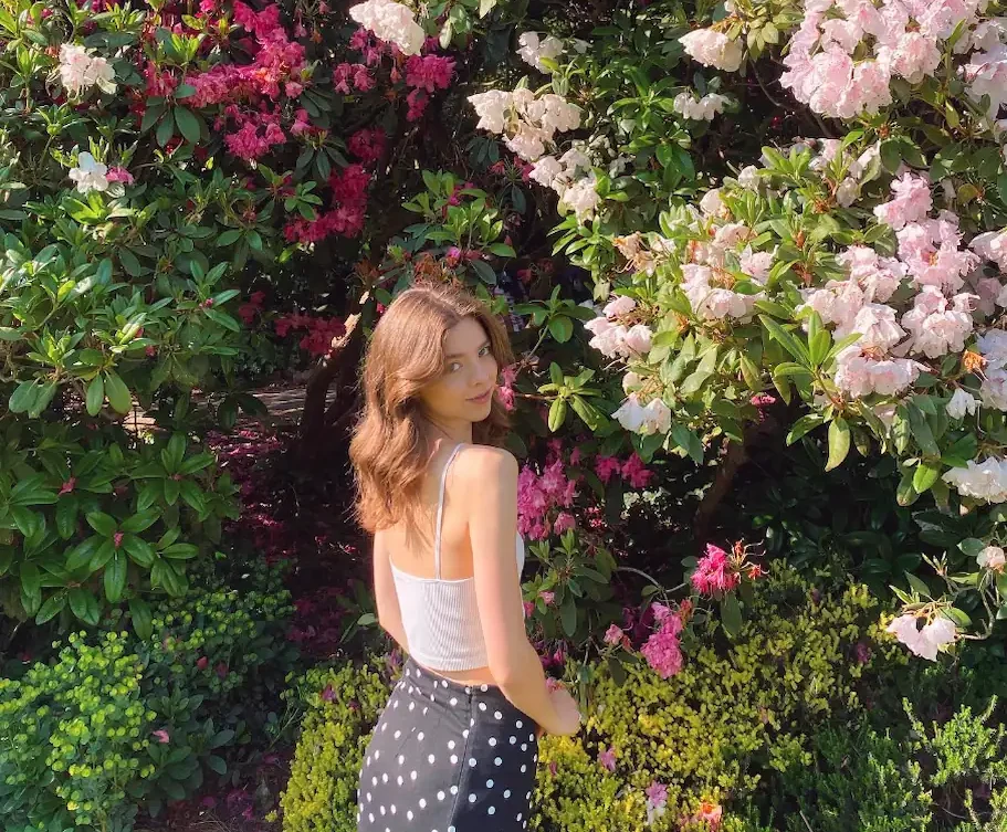 Me (Emily Morgan) standing in front of flowers