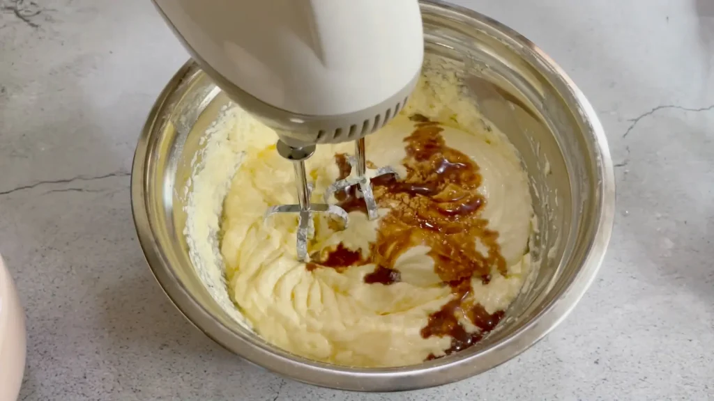 Adding Vanilla Extract and Milk into the Butter Mixture