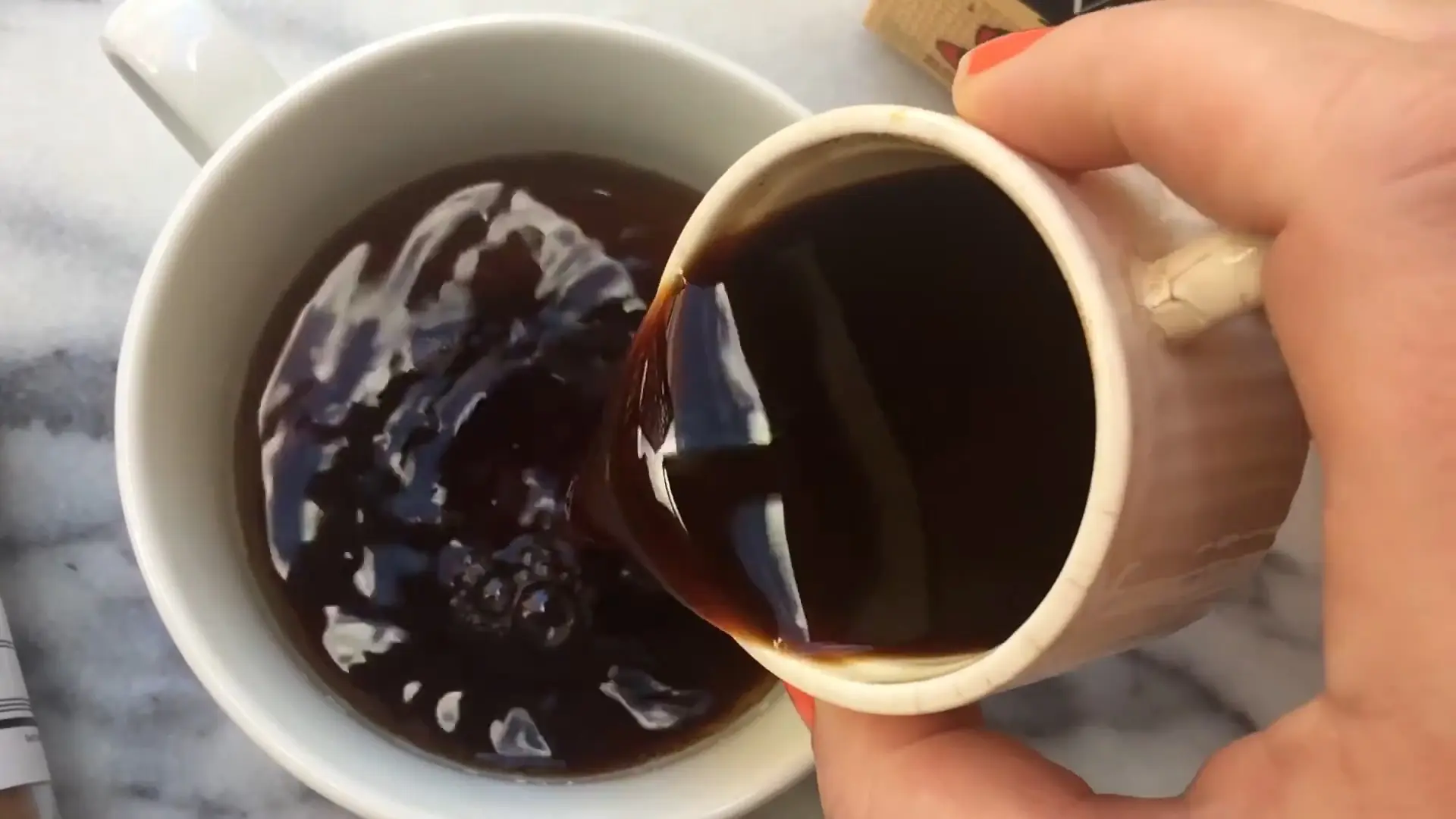 Pouring Brewed Espresso into Brewed Chai Tea Mixture