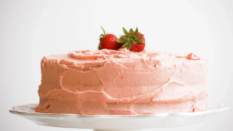 Strawberry cake in a dish with Whole Strawberries on top