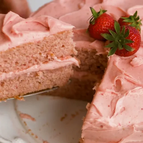 Cutting a large piece of Strawberry cake with Cake Cutter