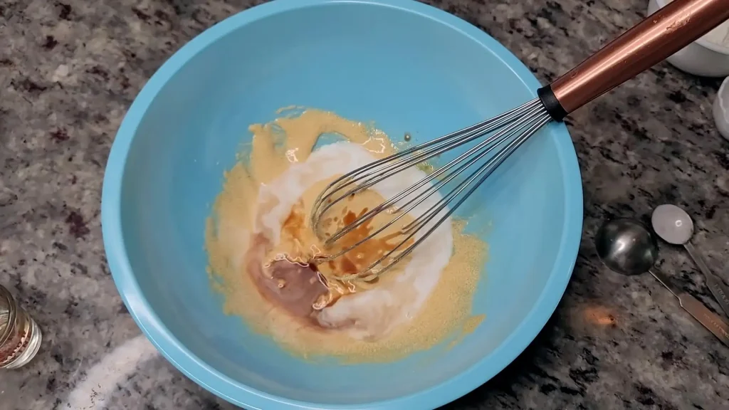 Beating Egg Yolks, Pouring Whole Milk and vanilla extract