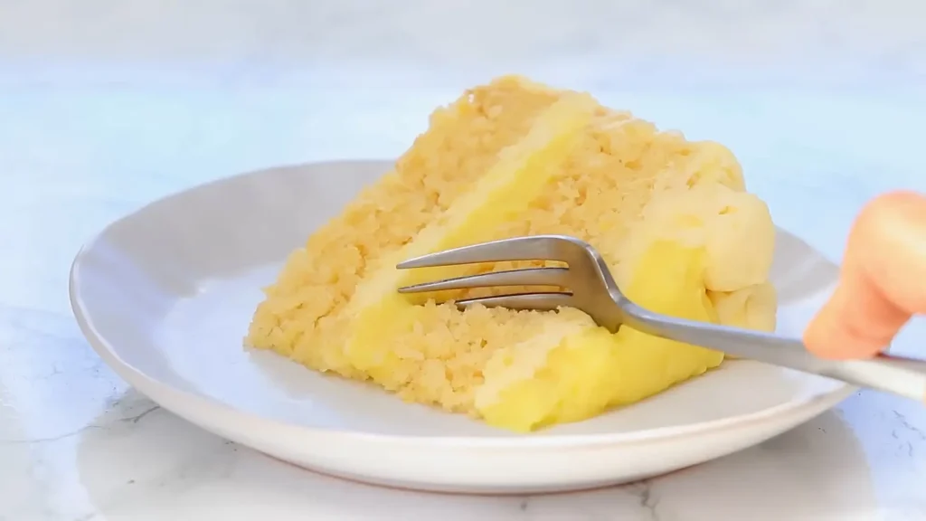 Taking a piece of pineapple cake with a fork