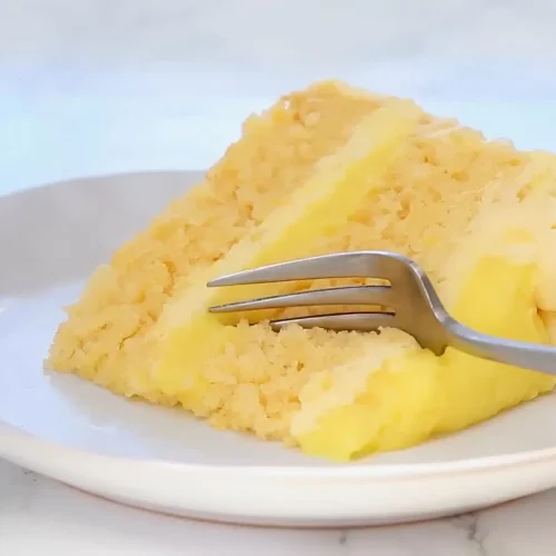 Taking a piece of pineapple cake with a fork