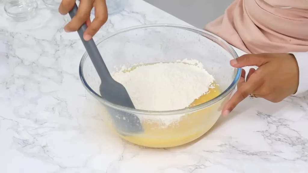 Adding Dry Ingredients to the butter mixture 