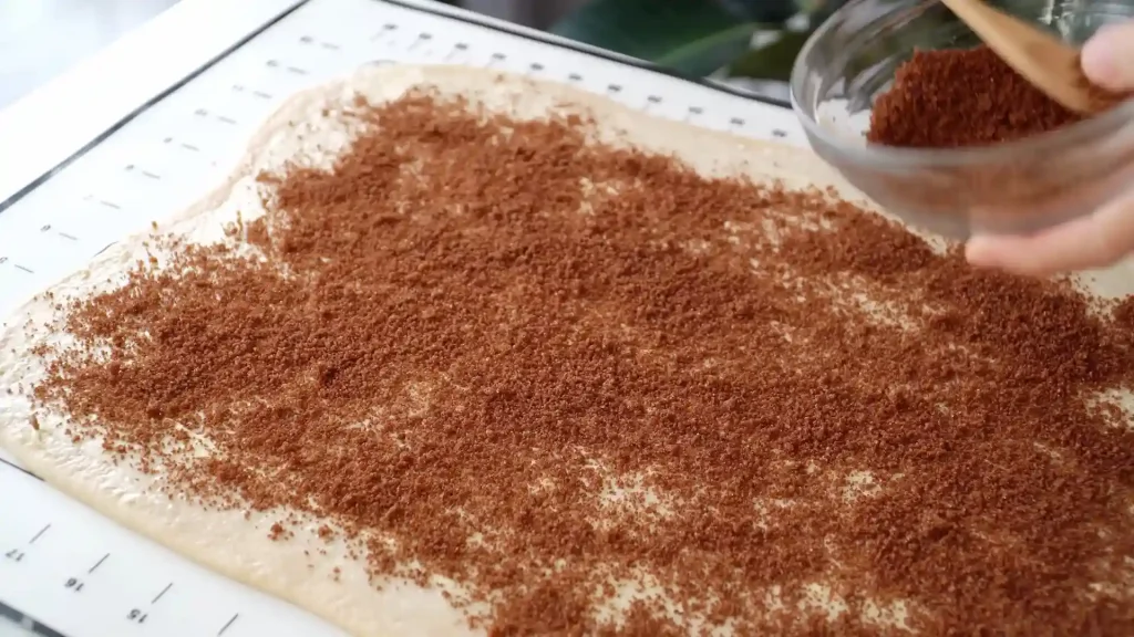 Sprinkle Mix brown sugar and cinnamon  over dough